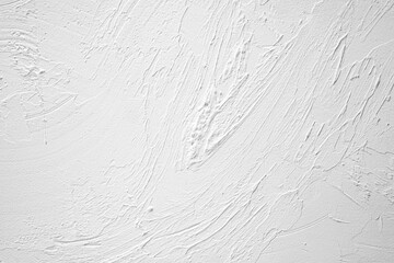 Surface texture showcasing white plaster artistry on a wall background