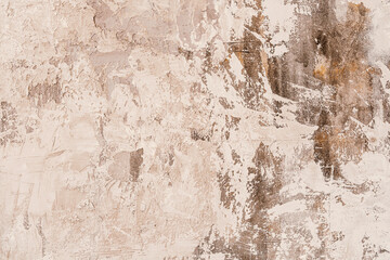 Textured wall surface with subtle tones of gray and beige in an indoor setting