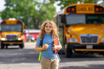 Back to school. School day starts for young student. Kid student with backpack near school bus. Kid go to school. Child going to class. Schoolchild.