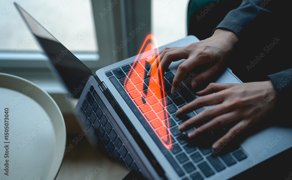Poster a person types on a laptop keyboard with a digital warning symbol, suggesting a cybersecurity or dat
