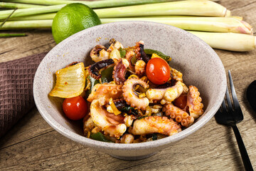 Roasted octopus with vegetables and oil