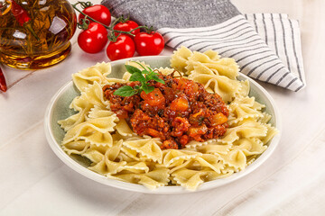 Italian pasta Farfalle Bolognese with meat