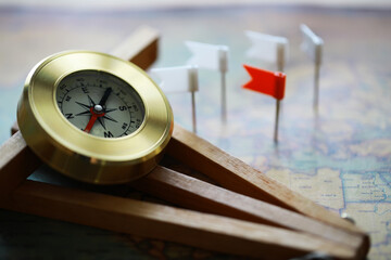 Antique Compass on Map with Flags - Navigation, Travel and Exploration Concept