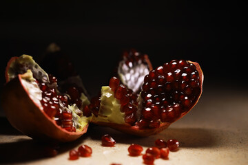 Close-Up of Pomegranate Seeds on Dark Background with Dramatic Lighting