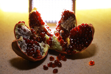 Fresh Pomegranate Seeds on Rustic Background with Natural Lighting