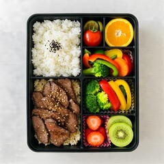Healthy Bento Box Lunch with Rice, Meat, Vegetables, and Fruit