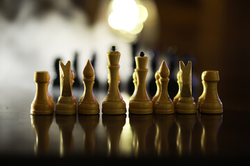 Strategic Chess Game with Golden Chess Pieces in Focus and Defocused Background