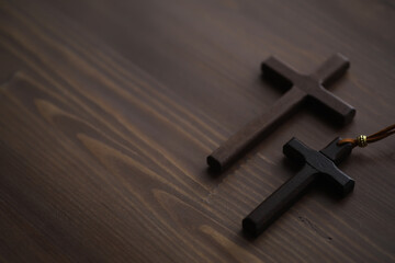 Wooden Crosses on Dark Wood Background: Christian Faith, Religious Symbol, and Spiritual Reflection