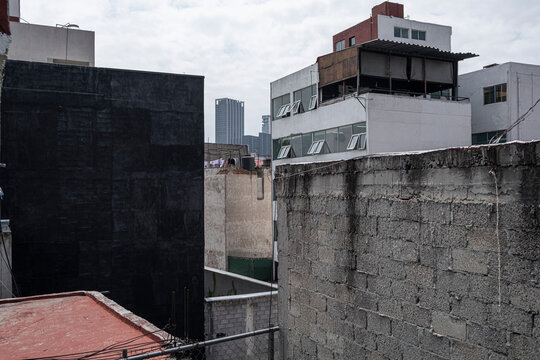 Mexico City residential rooftops with concrete walls and urban textures, ideal for background visuals, city infrastructure, and architectural design projects.