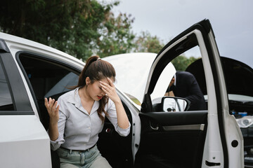 Man inspecting damaged car after crash, documenting insurance claim with mobile phone, showing...