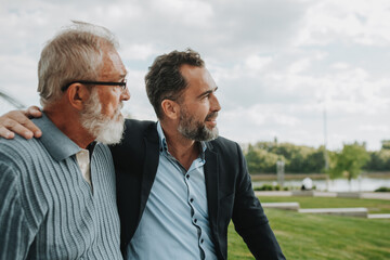 Father and adult son sharing a peaceful moment together.