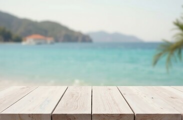 Fototapeta premium White wooden table top on blurred sea or ocean, white sand, mountains and clear sky, sunny day light background. side view, place for montage and showing products. Travel and vacation concept