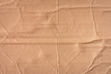 Beige cardboard texture. Crumpled cardboard. Copy space.