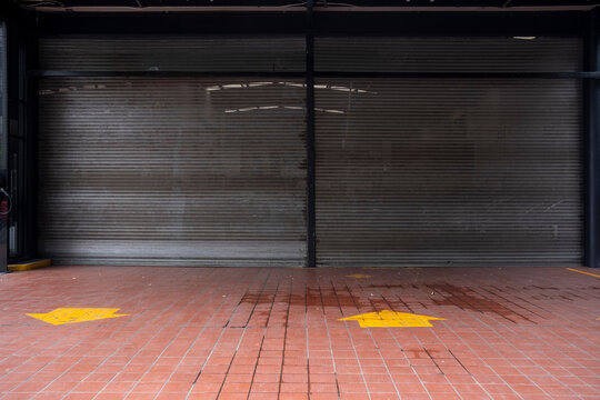 Urban parking garage entrance with yellow floor markings, minimal lines and textures, ideal for design, architecture, and city infrastructure stock imagery.