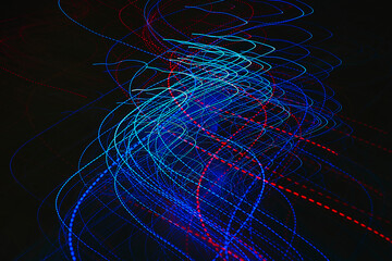 Abstract image of colorful red and blue light trails captured with long exposure.
