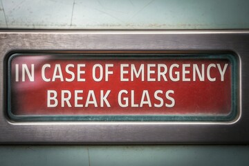 Emergency break glass sign with bold, clear instructions in red and white. Concept of Emergency Switch Improve Industrial Safety Standards.