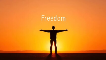Silhouette of a man with outstretched arms against the backdrop of a sunset and the inscription "Freedom"