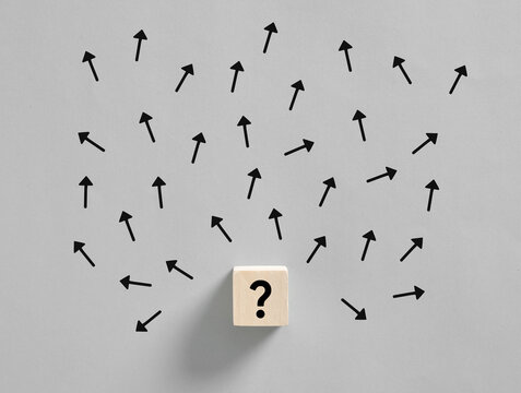 Question mark and many arrows pointing in different directions representing confusion and indecision