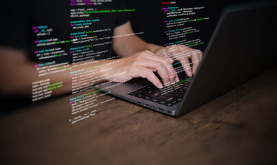 Hands of a programmer types on a laptop displaying programming code, symbolizing coding tech, software development, web applications. IT solutions, and digital technology
