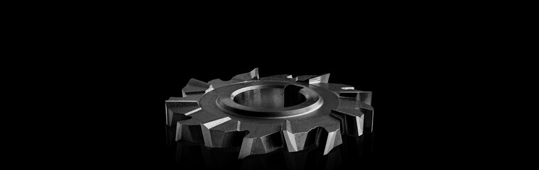 Sharp circular metal disc blade cutter made of durable steel for cutting metal, displayed on black backdrop showing essential tools used by machinists and fabricators in heavy-duty industries