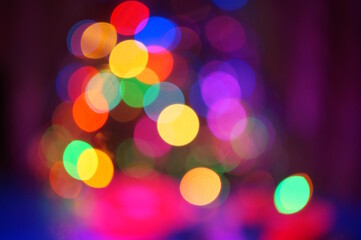 New Year's colorful illumination. Blurred bright background. Bokeh.