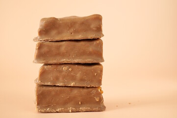 Chocolates on a pink background. Sweet food.