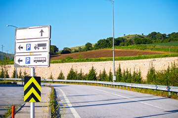 Old sign in car park. Direction sign at the break area. Long distance, road transport. Copy space,...