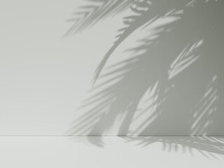 Soft shadows from palm leaves on a beige wall.