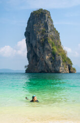 summer asian child swim relax in clear blue sea on beach or kid girl tourist wear swimming diving goggles to playing nature water at ko poda island in krabi thailand for people holiday vacation travel