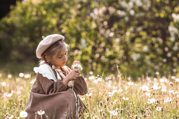 Vintage women's accessories and retro-style clothing. A small, beautiful girl with bows in her...