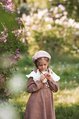 Vintage women's accessories and retro-style clothing. A small, beautiful girl with bows in her...
