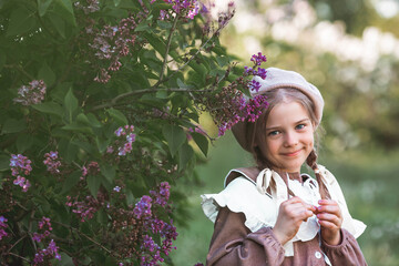 Vintage women's accessories and retro-style clothing. A small, beautiful girl with bows in her...