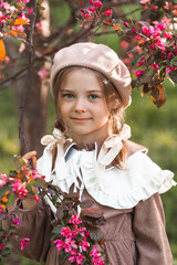 Vintage women's accessories and retro-style clothing. A small, beautiful girl with bows in her...