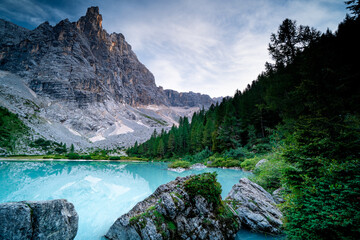 Evening over the clear Lake Sorapis in the Italian Dolomites. The azure color of the water.	
