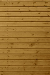 Background image of a wood shiplap panel side of a garden shed. Outdoor wooden panelling background