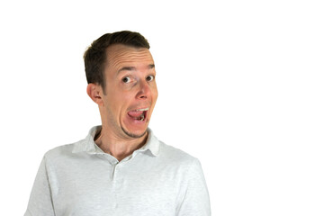 Obraz premium Man making exaggerated surprised face with open mouth and raised brow for comic reaction use. Isolated portrait. Transparent png.