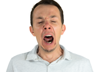 Yawning man with eyes closed and mouth wide open expressing tiredness or boredom. Isolated portrait. Transparent png.