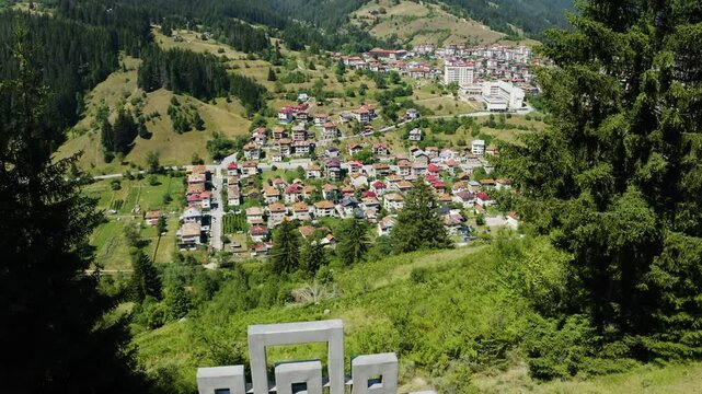 Aerial view of a town in the valley from the mountain
