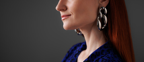 Web banner of stylish woman in earrings isolated on grey