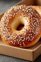 Delicious breakfast bagel in takeaway packaging. On bistro countertop.	
