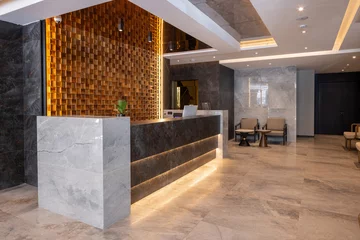 Fotobehang Hotel chique Modern hotel reception interior with decorative wooden wall  © rilueda