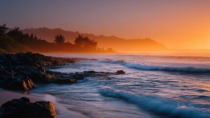 Serene sunset over rocky hawaiian beach with waves and mountains
