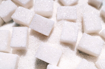 Cubes of white refined sugar close-up. Food background, sweetness, cooking ingredient. Sugar...