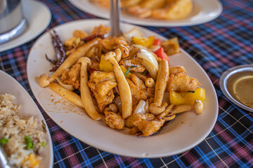 Stir-fried Chicken with Cashew Nuts in a restaurant by the sea, Phuket Thailand