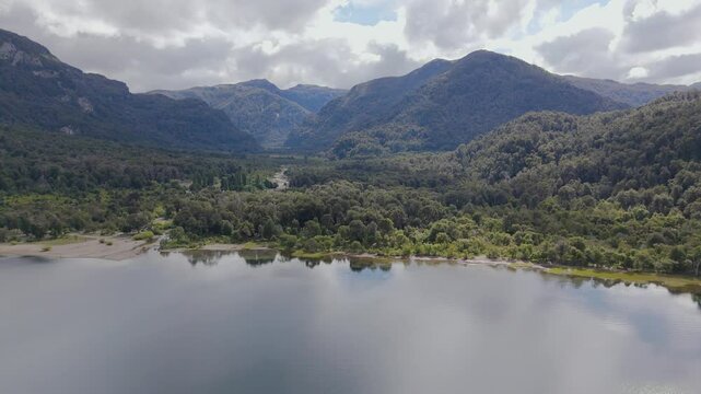 Mountain valley view with lush forest and calm lake, Pichi Trafull region, Patagonia