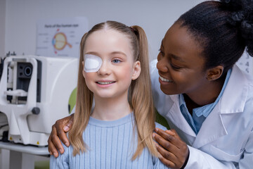 Girl having an exam at the ophthalmologist office and looking positive