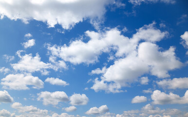 A beautiful blue sky with soft, white clouds, for an abstract background
