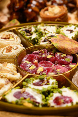 Sweet food Turkish delight on wooden background, assorted locum and candy for decorated backdrop