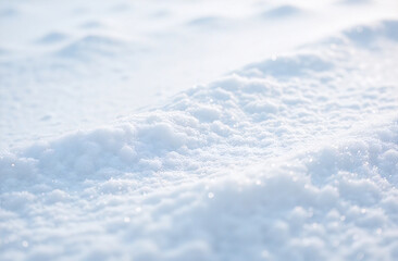 Obraz premium Wind-swept snow surface texture with gentle ridges and shine