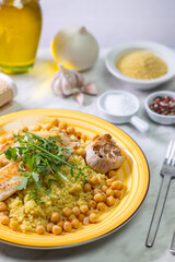 grilled cod with couscous, chicken pea and baked garlic